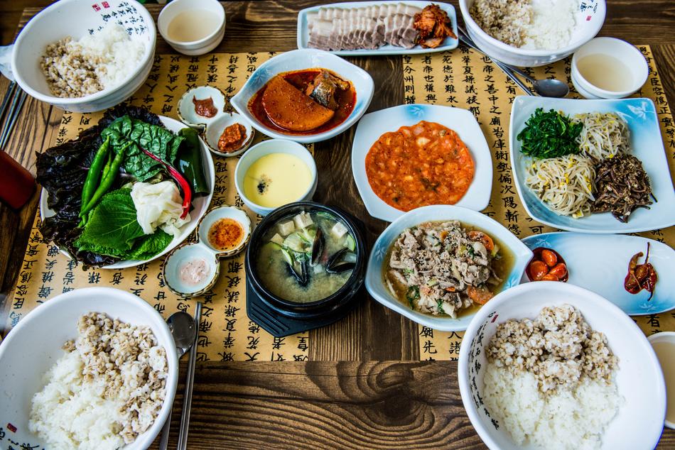 Top view of the colorful and beautiful Korean dishes, on the wooden table