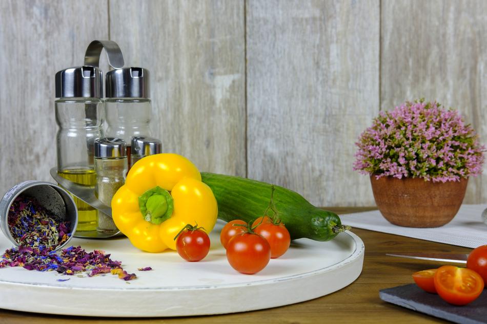 Beautiful and colorful, shiny vegetables and spice blossoms, near the wooden wall