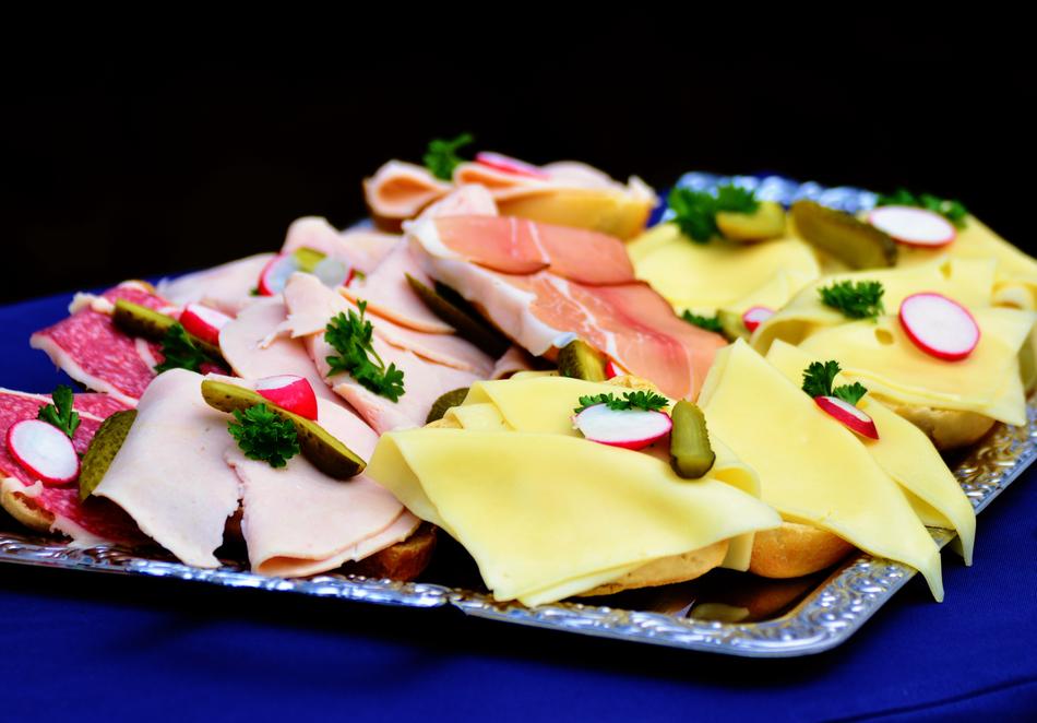 Beautiful and colorful sandwiches with meat and cheese, on the tray