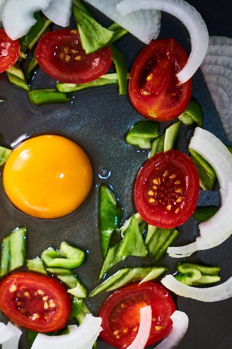 Egg with the colorful and beautiful, cut vegetables around