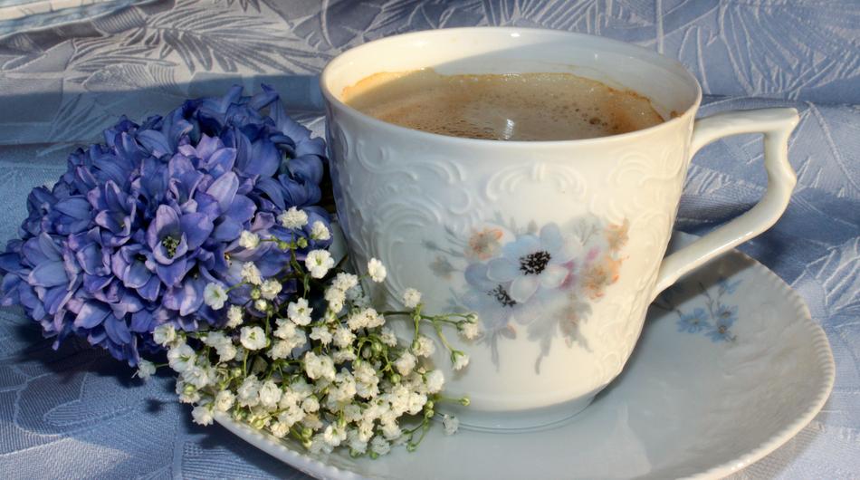 Coffee Cup and flowers close up