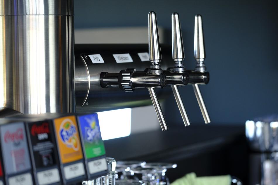 Colorful logos of drinks, on the shiny dispensing system