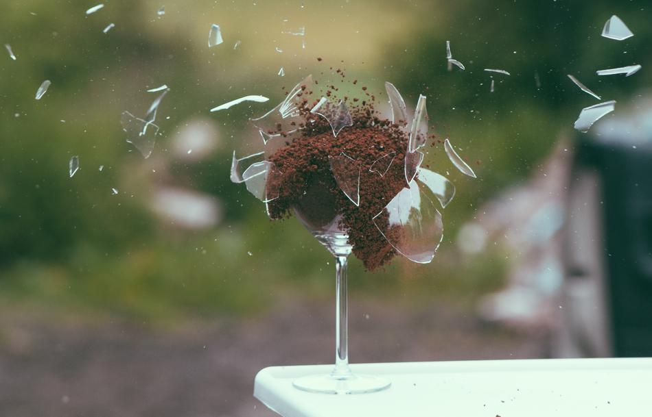 shards of glass and ground coffee