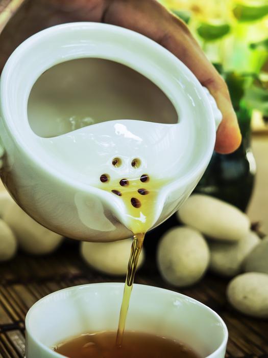 pouring tea in a tea ceremony close-up
