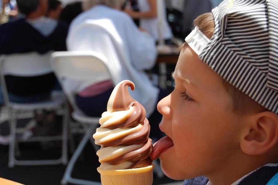 boy with ice cream on the street in summer
