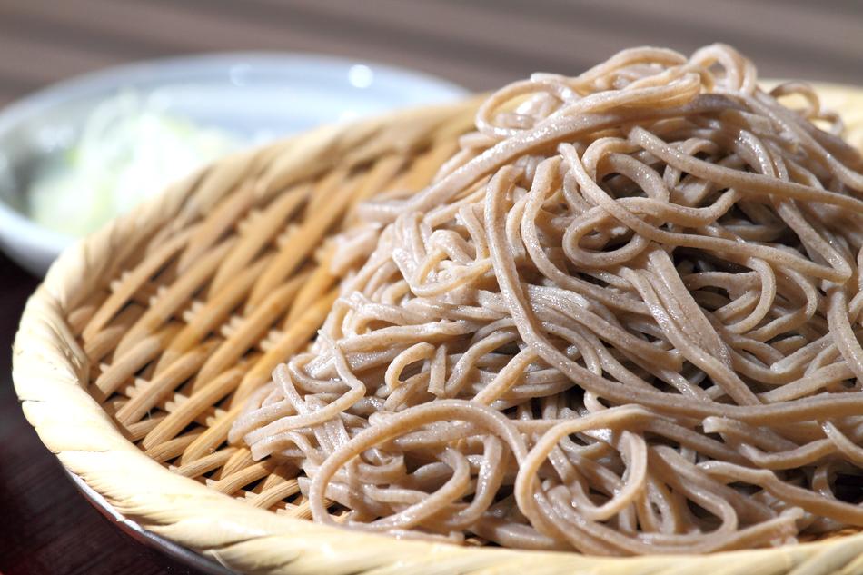Soba Noodles in a wicker bowl close-up