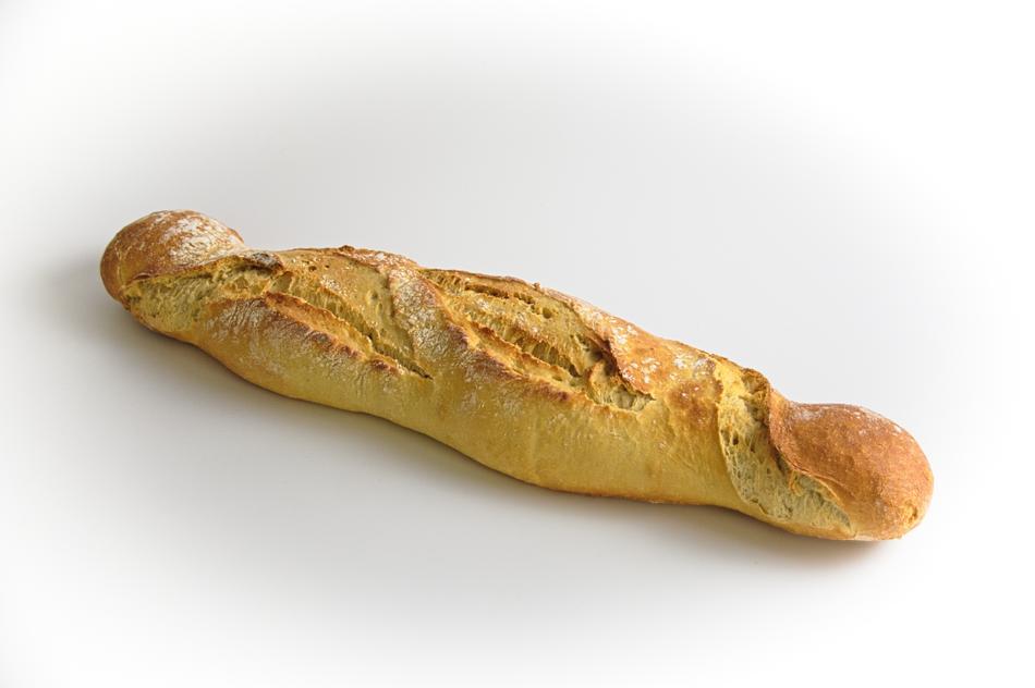 Close-up of the beautiful bread baguette, on the grey surface, among the white frame