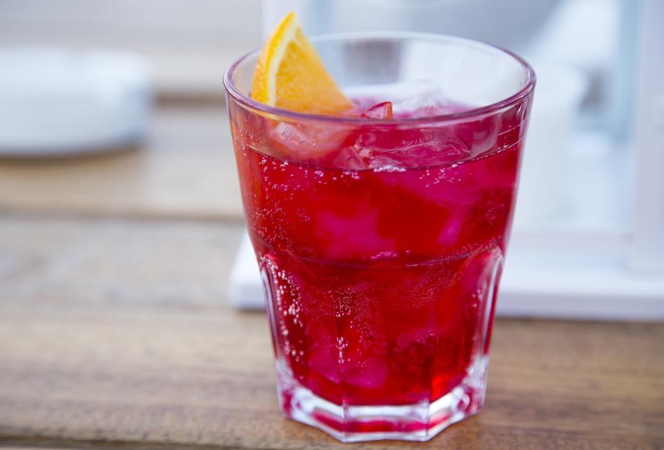 campari soda with lemon in a glass