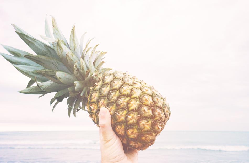Pineapple Holding Fruit