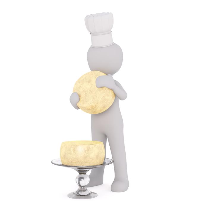 white chef man and fresh heads of cheese