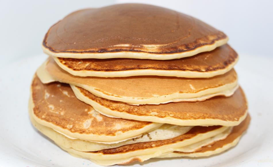 a stack of pancakes on a white background