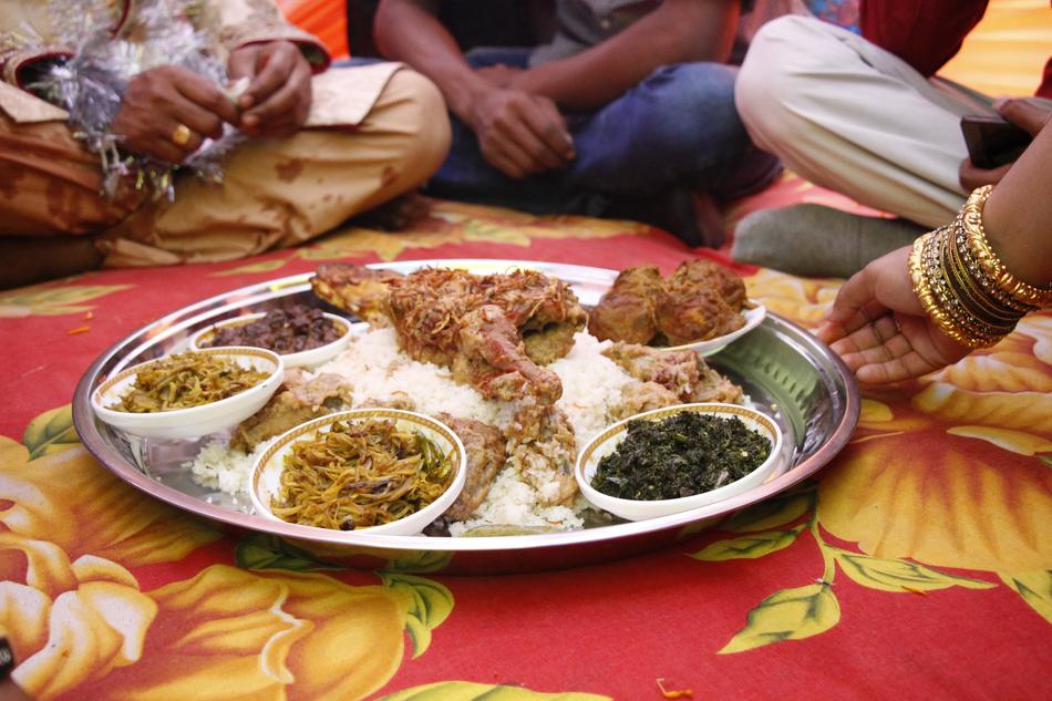 Shiny plate with the colorful food on lunch, among the people