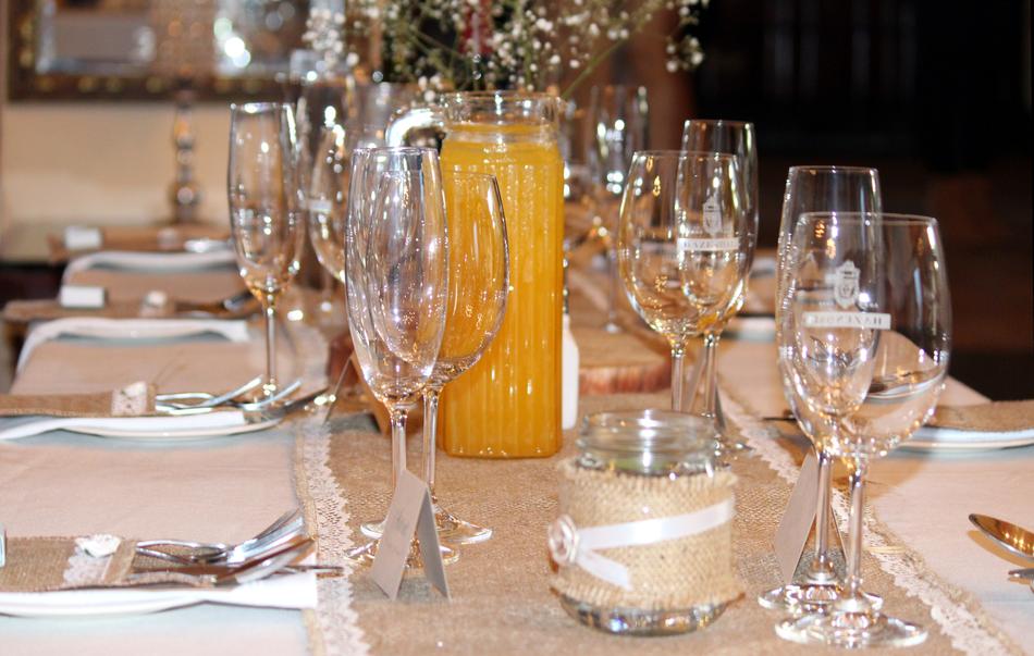 Close-up of the wedding table with orange juice and cutlery, in the restaurant