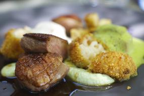 Close-up of the meat dish with vegetables, in the sauce