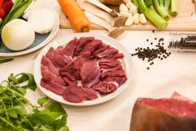 raw meat and vegetables