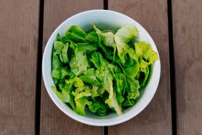 Salad fresh leaves on wood table