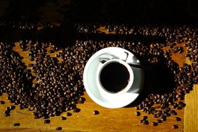 Coffee Cup and beans in Cafe