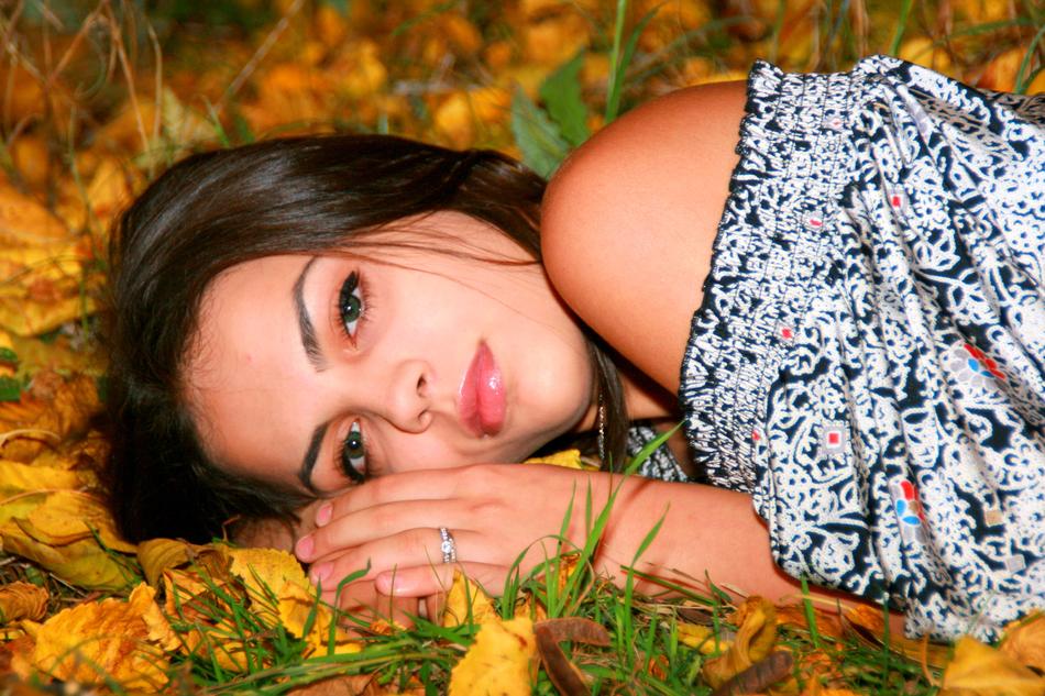 Girl lyin on Yellow Leaves