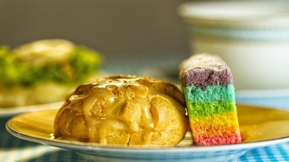 bun and rainbow cake on a plate