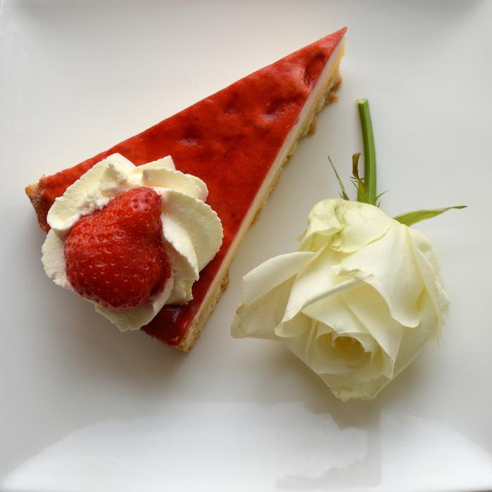 Slice of Cake with Toppings and white rose flower