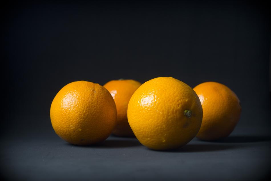 four Oranges, Fruits at black background