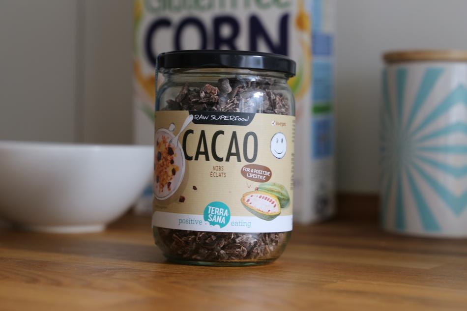 Raw Cocoa Nibs in jar on table