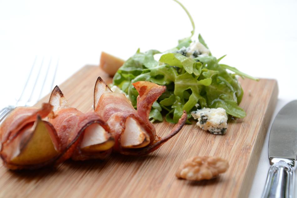 pear with bacon on chopping board