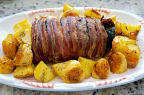 meat and potatoes on plate