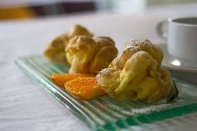 Choux pastry on a plate with orange
