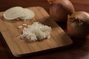 Sliced onions on board
