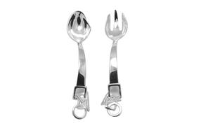 Two silver spoons on a white tablecloth