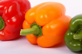 fresh Vegetables, three bell Peppers side by side