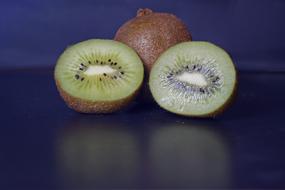 cut and whole Kiwi, Tropical Fruits