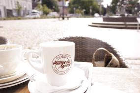 white cup in cafe