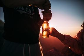 silhouettes people with bottle