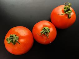 Three ripe tomatoes