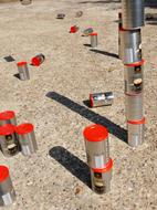 iron cans in sand