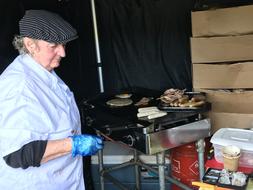 woman cooks food