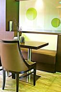 cushioned chair near table