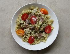 Pasta and tomatoes in plate