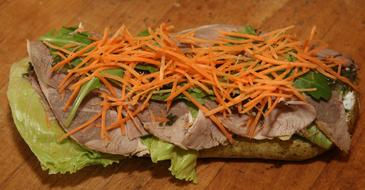 Sandwich with carrot meat and lettuce