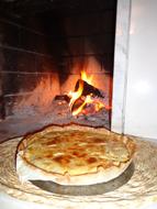 baked food near fireplace
