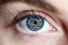image of the planet in the female eye
