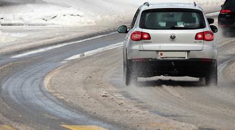 cars ride on a winter snowy road