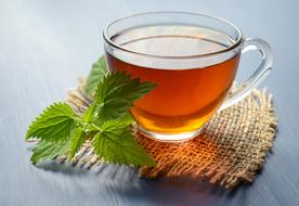 cup of tea and mint on a canvas napkin