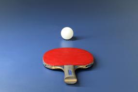 red Table Tennis racket on blue table