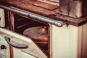 vintage copper Bed Bottle in Oven