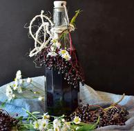 black elderberry drink in a bottle