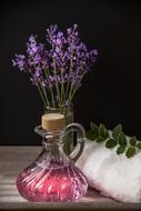 lavender bouquet and oil in a transparent vessel