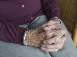 hands of an elderly woman on her knees